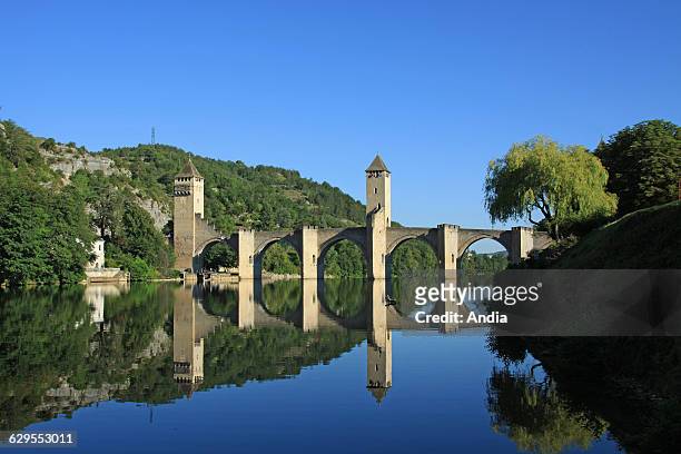 Cahors , Valentre Bridge , also known as the Devil's Bridge, is a fortified bridge dating back to the XIVth crossing the Lot River to the west of...