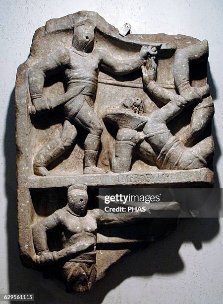 Fragment of a commemorative relief of an unknown gladiator's ventures, portrayed in several fights with his adversaries retiatii . The inscription...