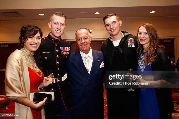 Actor Tony Sirico poses with USO George Van Cleave Military Leadership Award winners U.S. Marine Corps Cpl. Daniel L. Meinema and U.S. Navy Petty...