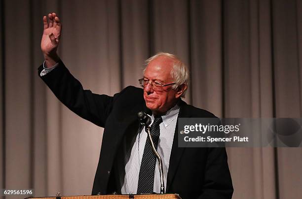 Former presidential candidate and Vermont Senator Bernie Sanders waves to the audience gathered to hear him speak at The Cooper Union on December 13,...