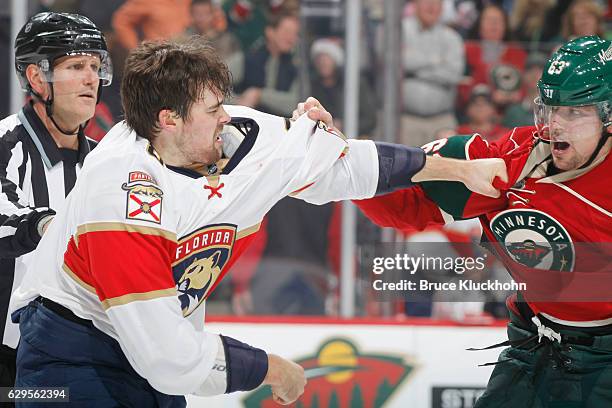 Dylan McIlrath of the Florida Panthers and Kurtis Gabriel of the Minnesota Wild fight during the game on December 13, 2016 at the Xcel Energy Center...