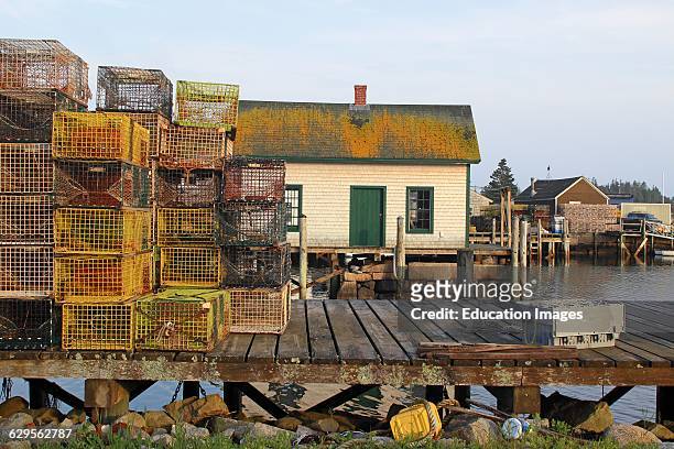 Lobster docks with sheds Vinalhaven Island Maine New England USA.