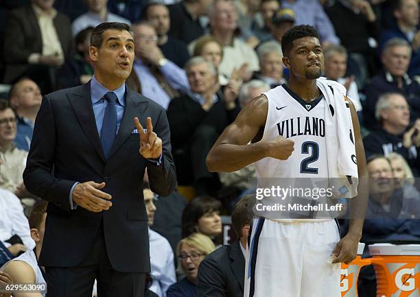 Head coach Jay Wright and Kris Jenkins of the Villanova Wildcats react from the bench in the second half against the Temple Owls at The Pavilion on...