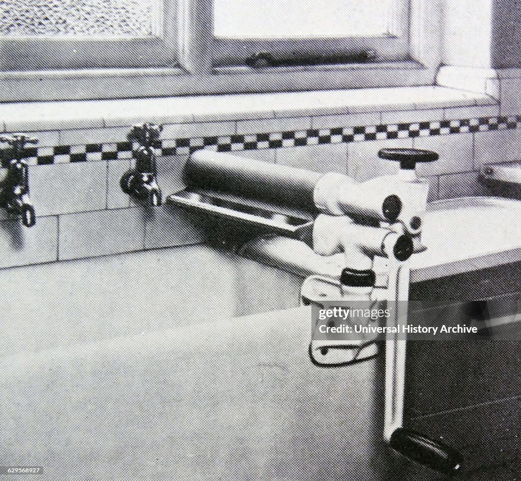 sink-top-mangle-used-for-wringing-out-wet-clothes-british-dated-1955.jpg