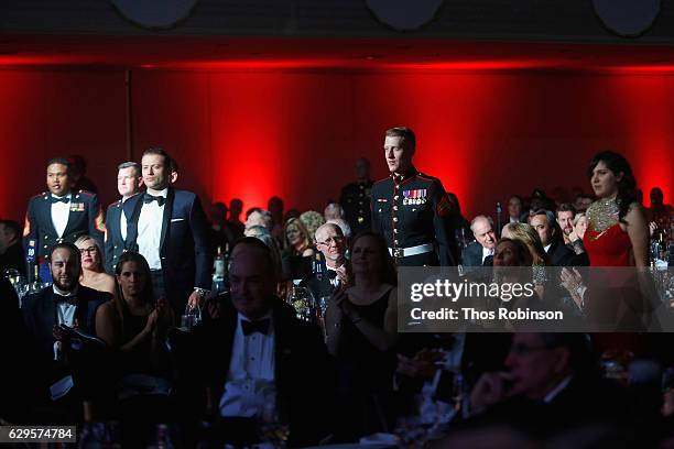 Active servicemembers rise for acknowledgement during the USO 75th Anniversary Armed Forces Gala & Gold Medal Dinner at Marriott Marquis Times Square...