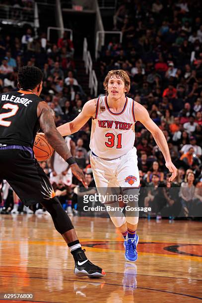 Ron Baker of the New York Knicks handles the ball during a game against the Phoenix Suns on December 13, 2016 at Talking Stick Resort Arena in...