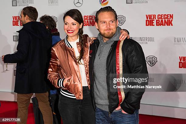 Julia Hartmann and Axel Stein attend the German premiere of the film 'Vier gegen die Bank' at CineStar on December 13, 2016 in Berlin, Germany.