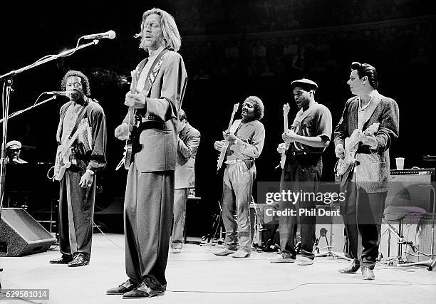 Eric Clapton performs on stage with blues musicians at the Royal Albert Hall, London, 1991. L-R Buddy Guy, Eric Clapton, Jerry Portnoy, Albert...