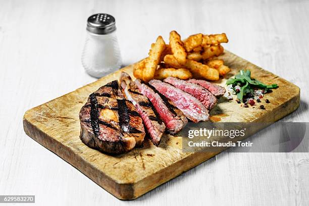 grilled steak with french fries - french fries white background stock-fotos und bilder