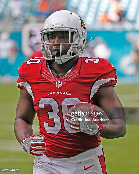 Stepfan Taylor of the Arizona Cardinals runs with the ball prior to the game against the Miami Dolphins on December 11, 2016 at Hard Rock Stadium in...