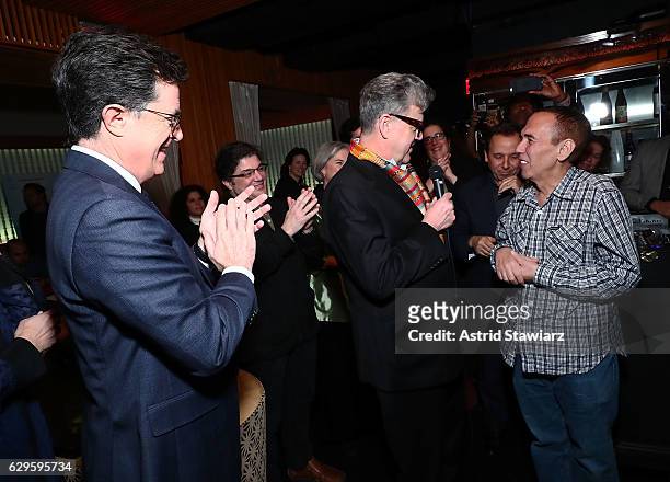 Stephen Colbert, Jonathan Freeman and Gilbert Gottfried speak during a cocktail party in celebration of "Life, Animated" at Megu New York on December...