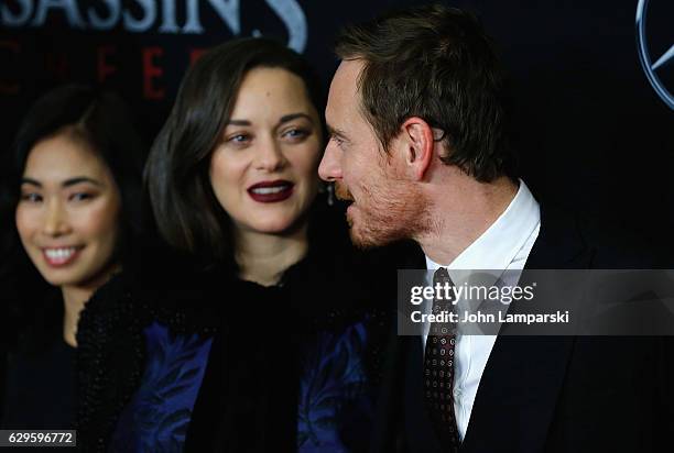 Michelle Lin, Marion Cotillard and Michael Fassbender attend "Assassin's Creed" New York premiere at AMC Empire 25 theater on December 13, 2016 in...