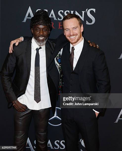 Michael Fassbender and Michael K. Williams attends "Assassin's Creed" New York premiere at AMC Empire 25 theater on December 13, 2016 in New York...