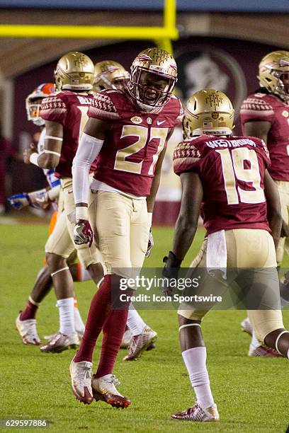 Florida State DB Marquez White and Florida State DB A.J. Westbrook celebrate after making a play on defense during the NCAA football game between the...