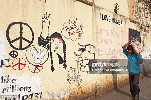 India, Maharashtra, Mumbai, 'Art wall' covered with slogans, graffiti and drawings to encourage Mumbai people to be positive and upbeat and...