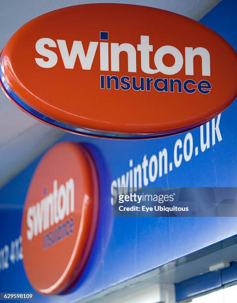 Business, Finance, Insurance, Swinton Insurance sign and logo on a high street bank building.