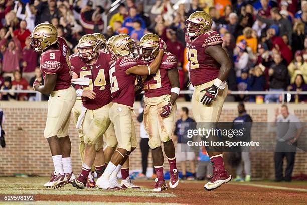 Florida State FB Freddie Stevenson scores a touchdown and celebrates with OL Wilson Bell , RB Jacques Patrick , WR Travis Rudolph and OL Alec Eberle...