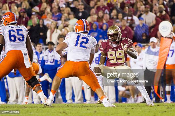 Florida State DT Brian Burns attempts to sack Florida quarterback Austin Appleby during the NCAA football game between the Florida State Seminoles...