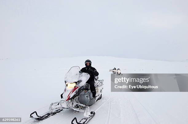 Iceland, Langjokull Glacier with tourists on a ski doo trip.