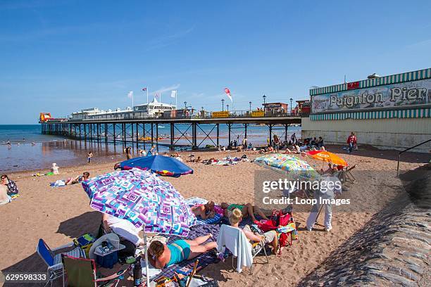 Holidaymakers on the beach at Paignton, Paignton, England.