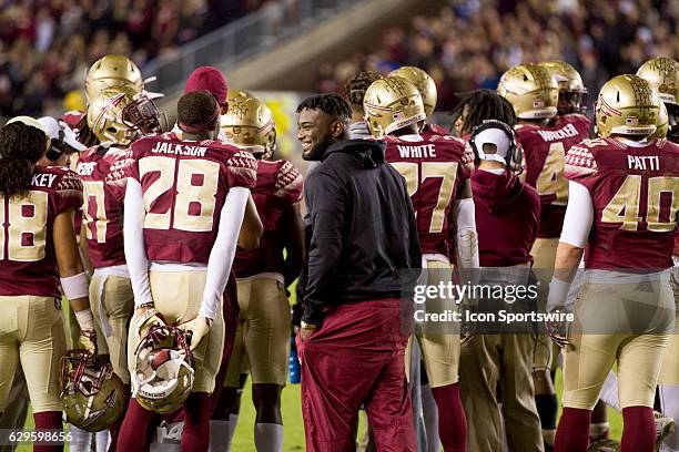 Florida State DB Nate Andrews laughing with teammates in the huddle during the NCAA football game between the Florida State Seminoles and the Florida...