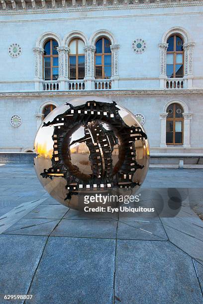Ireland, Dublin, Trinity College, Arnaldo Pomodoro's Sphere within a Sphere sculpture outside the Berkeley Library.