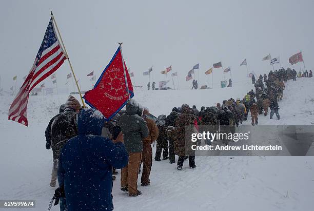 On the day of a government order to vacate the area, hundreds of United States military veterans vow to defend the Standing Rock protest camp and...