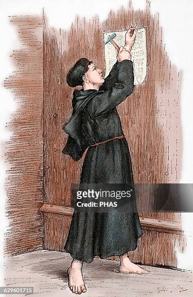 Martin Luther . German reformer. Luther hanging his 95 theses in Wittenberg, 1517. Engraving in Germania, 1882. Colored.