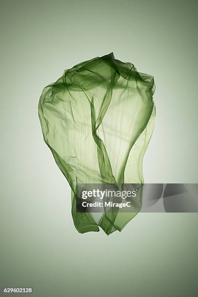 cabbage shape green plastic bag - scrunched plastic bag stock pictures, royalty-free photos & images
