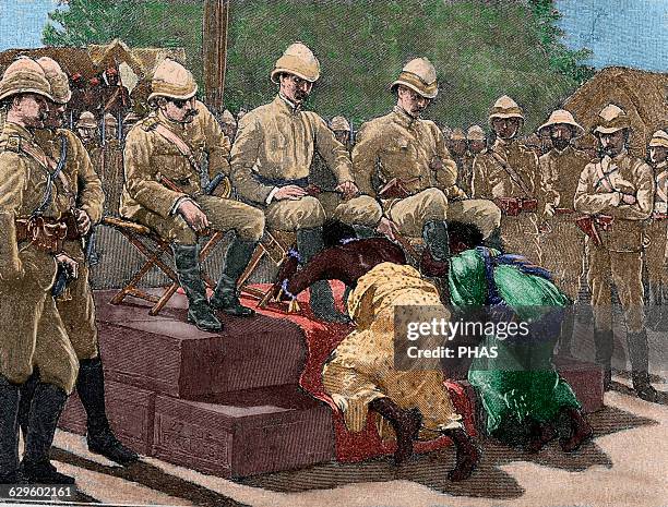 Act of submission of Ashanti king Prempeh and his mother embracing the legs of British representatives, Governor Maxwell, Colonel Kempster and Sir...