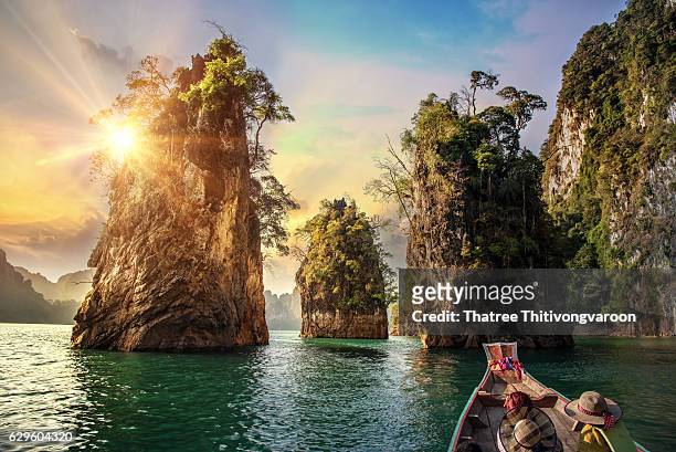three rocks in cheow lan lake, khao sok national park at suratthani,thailand - idyllic stock pictures, royalty-free photos & images