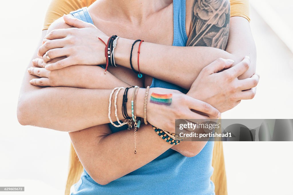 Close up of women embracing on bridge