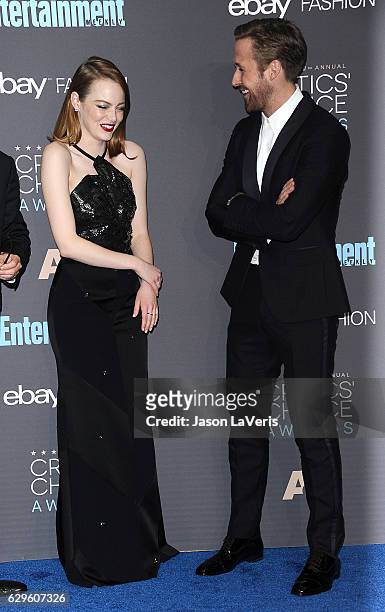 Actress Emma Stone and actor Ryan Gosling pose in the press room at the 22nd annual Critics' Choice Awards at Barker Hangar on December 11, 2016 in...