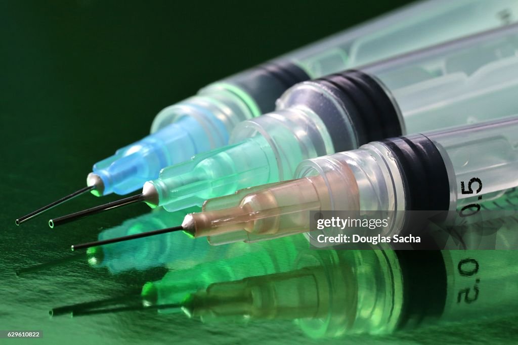 Variety of Hypodermic Needle sizes attached to Syringes