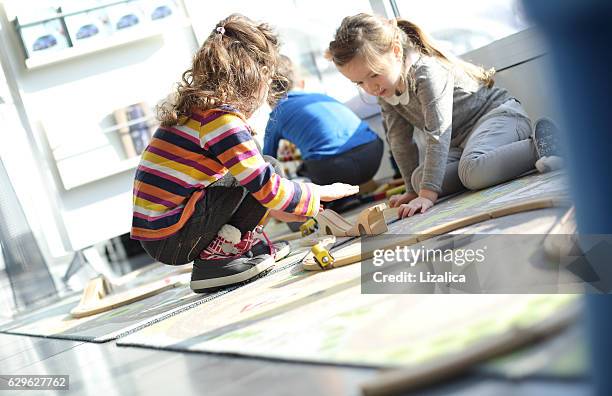 children playing with toy - preschool building stock pictures, royalty-free photos & images