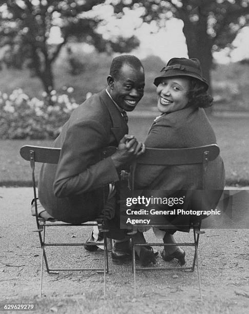 Nigerian musician and composer Fela Sowande with his fiance, American soprano Mildred Marshall, in Regent's Park, London, 13th September 1936....