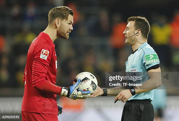 Goalkeeper Thomas Kessler of Cologneand referee Felix Zwayer gestures during the Bundesliga match between 1. FC Cologne and Borussia Dortmund at the...