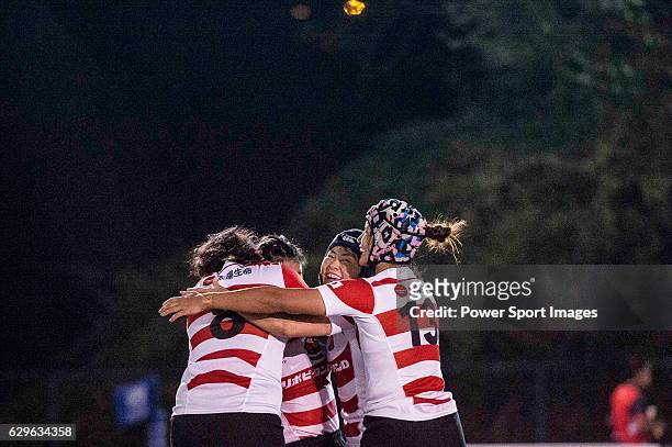 Makiko Tomita celebtrating with her teammates after scoring during the Women's Rugby World Cup 2017 Qualifier match between Japan and Fiji on...