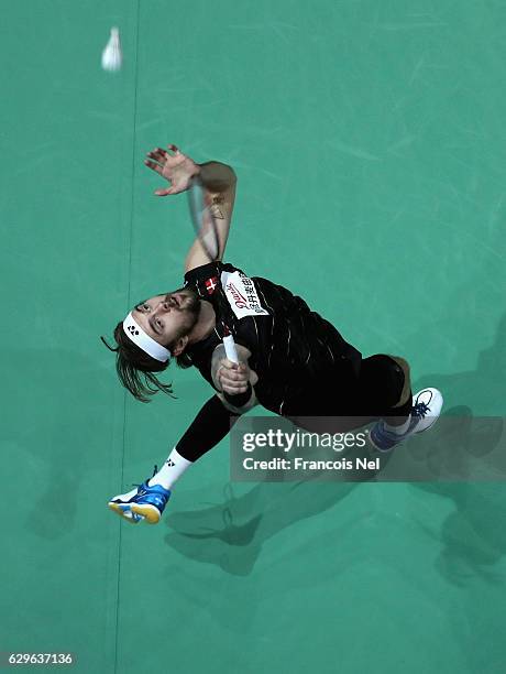 Jan O Jorgensen of Denmark competes against Hu Yun of Hong Kong in the Men's single match during day one of the BWF Dubai World Superseries Finals at...