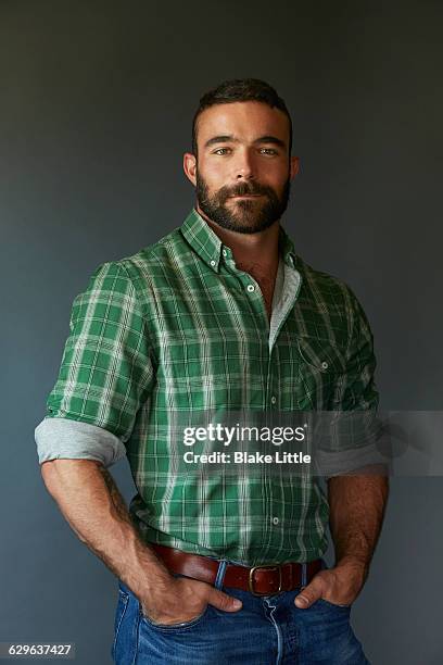 bearded man in plaid shirt - green shirt stock pictures, royalty-free photos & images