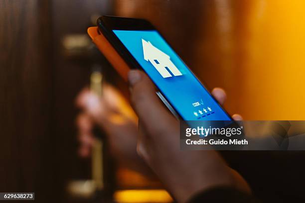 woman using home app. - smarthome stock-fotos und bilder