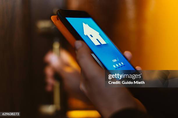 woman using home app. - smart home foto e immagini stock