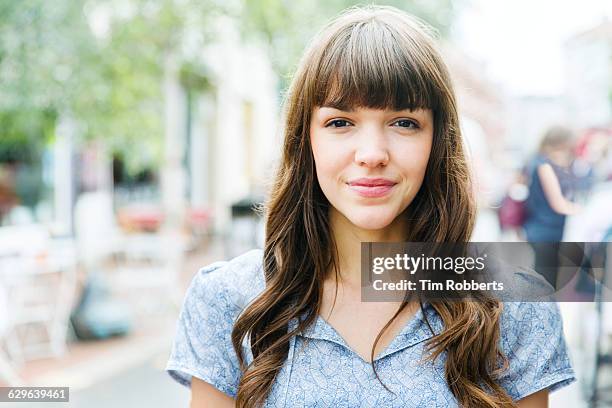 portrait of woman on street - bangs stock pictures, royalty-free photos & images