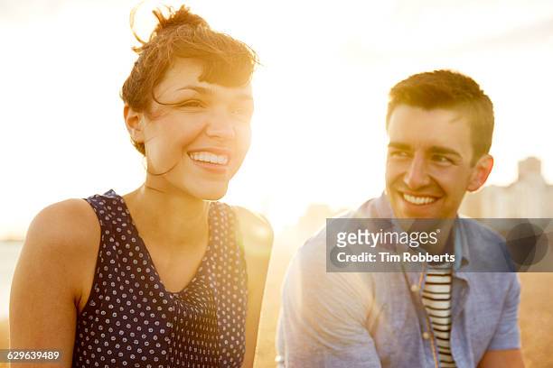 man and woman at sunset - speckled sussex stock pictures, royalty-free photos & images