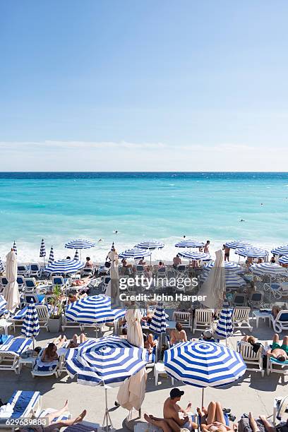 beach in nice, france - côte d'azur stock-fotos und bilder