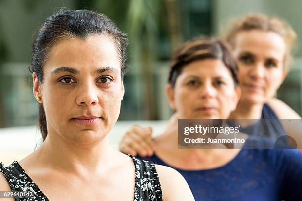 serious mature women - migration people stock pictures, royalty-free photos & images