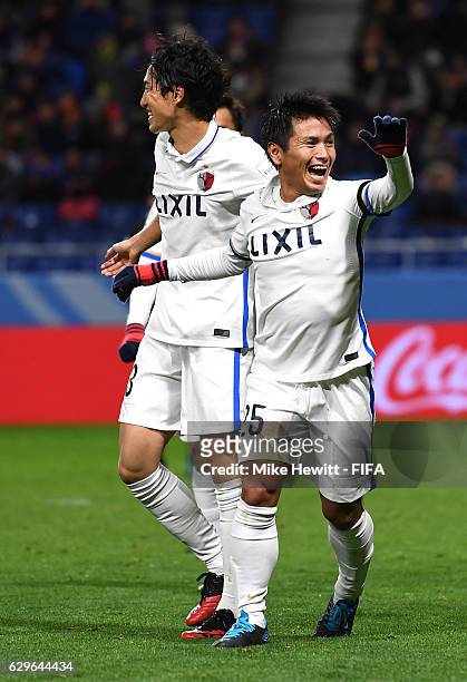 Yasushi Endo of Kashima Antlers celebrates scoring his sides second goal with team mates during the FIFA Club World Cup Semi Final match between...