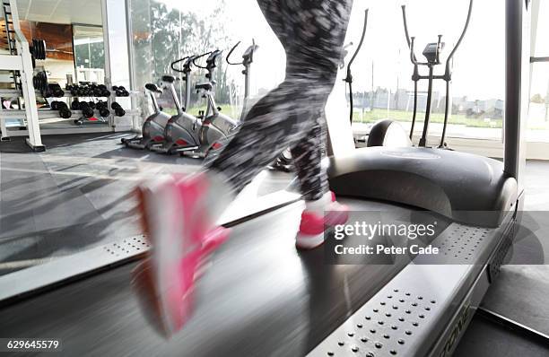 woman's legs running on treadmill in gym - pink shoe stock pictures, royalty-free photos & images