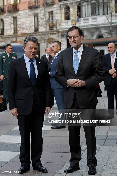 President of Colombia Juan Manuel Santos and Spanish Prime Minister Mariano Rajoy pose for photographers as they arrive at the Premio Nueva Economia...