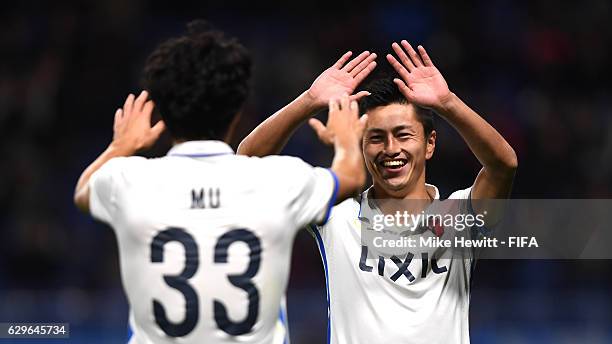 Yuma Suzuki of Kashima Antlers celebrates with Mu Kanazaki of Kashima Antlers after scoring his sides third goal during the FIFA Club World Cup Semi...